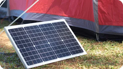 portable solar panels outside next to a tent