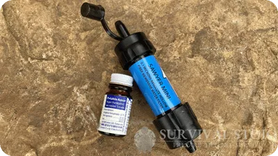 Picture of water purification tablets and a Sawyer mini water filter