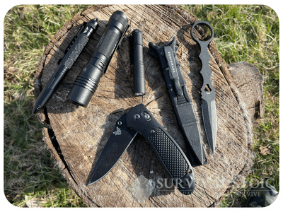 EDC knives and flashlights on a stump