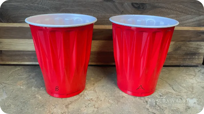 Blind taste test setup, two cups, one marked with "A" and one marked with "B"