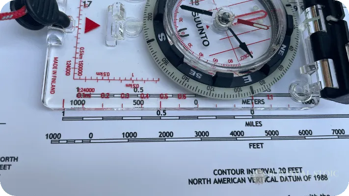 The author's compass and map, comparing the scales on the compass to the map