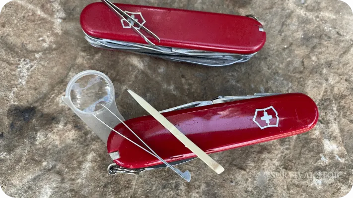 Two of the author's multitools showing the first aid tools