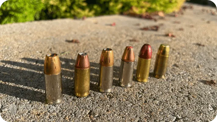 The Author's 9mm Bullets, 5 purchased and one he reloaded. Each has a different bullet type and weight