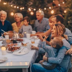 Self/Home/Family Defense Guides and Gear Reviews
Family enjoying a meal outdoors with small children.