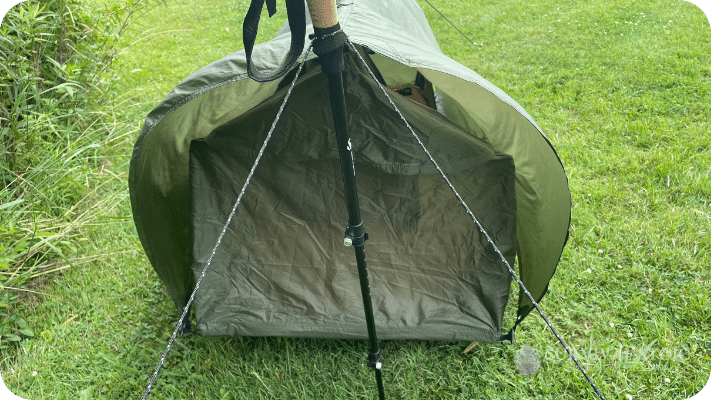 The Haven tent setup on the ground showing the rain fly blowing in the wind