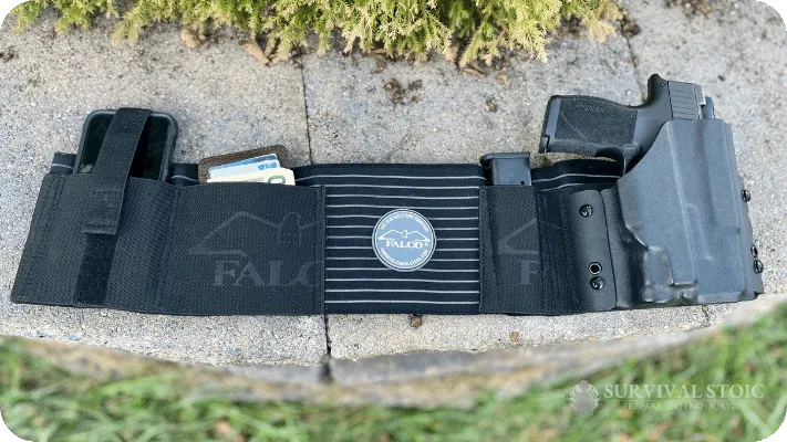 Kristin's Belly Band showing it with a Sig P365XL, extra magazine, phone, and wallet