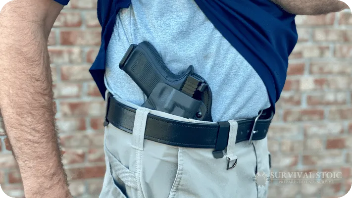 The author showing a concealed carry holster at the 3 o'clock position