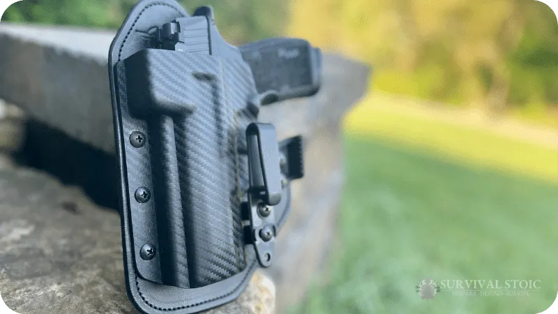 Blakes's hidden hybrid single clip holster and Sig P365 XMacro from a top angle showing the optics cover