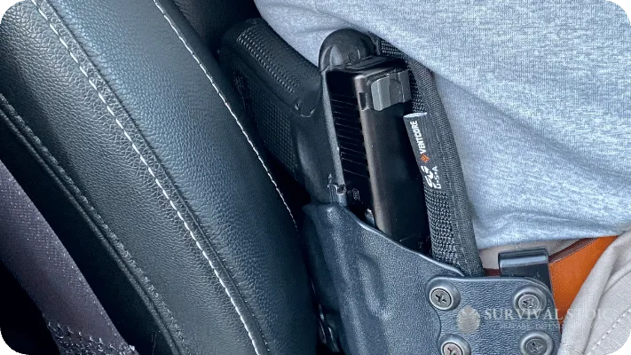 Jason sitting in a car with an OWB holster
