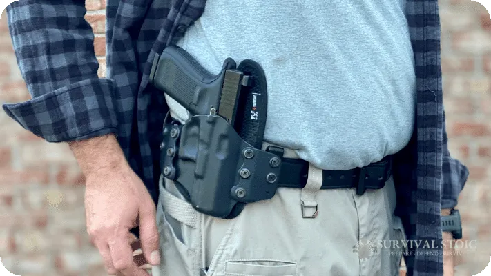 The author showing the stealth gear OWB holster and a Glock 19