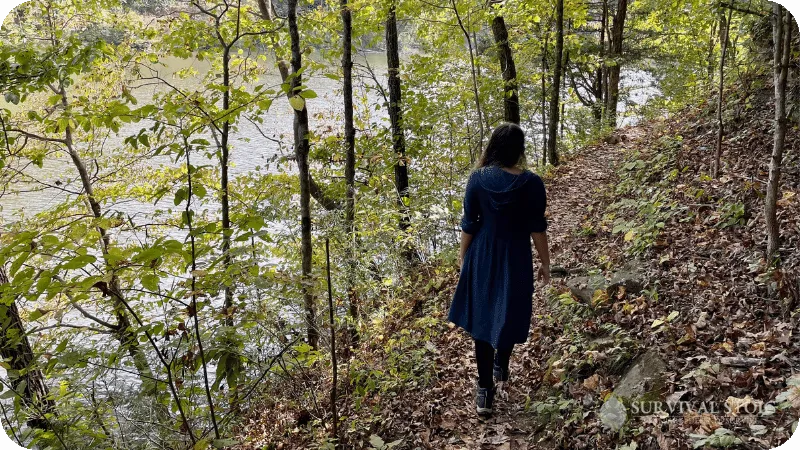 Kristin hiking beside a lake