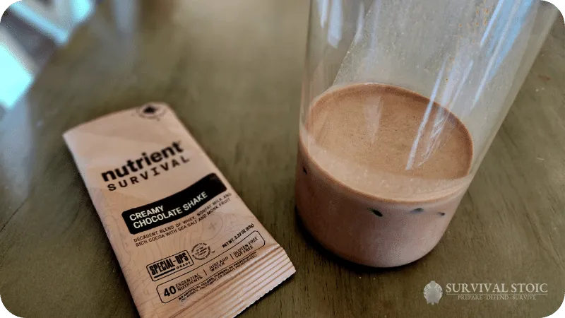 Kristin showing the Nutrient Survival Chocolate shake prepared