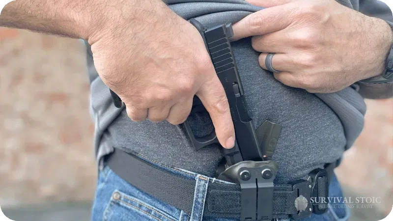 Jason with his concealed carry gun drawing it from a holster