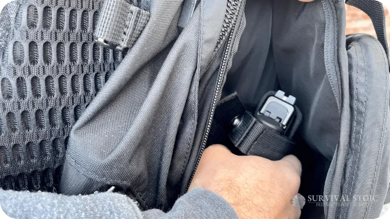 Jason drawing a Glock 19 from a concealed carry backpack