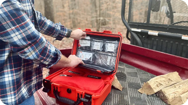 Jason opening the Roadie Pro Plus in the back of a side by side in the woods