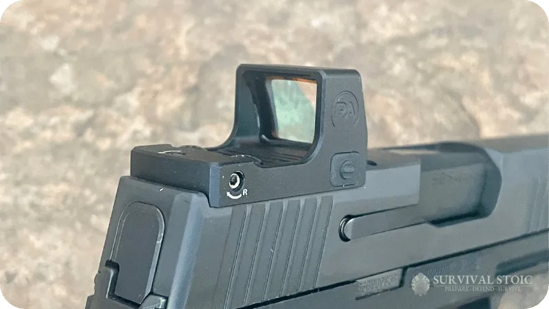 The Primary Arms micro mounted to Jason's handgun, shown from the right