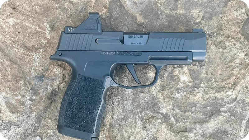 The RFX11 mounted to Jason's handgun, shown from the side